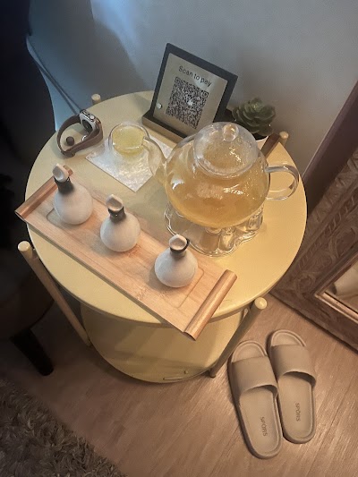 Aykiz spa tea service setup with teapot, cups, and accompanying beverages on round table with QR code payment option — Items: Tea Service · Herbal Tea Pot · Tea Cups
