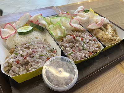 Papa Ayam fried rice dishes served in yellow containers with vegetable garnish and cucumber slices, accompanied by a sauce container. — Items: Fried Chicken Rice · Mixed Fried Rice · Fried Rice with Shrimp
