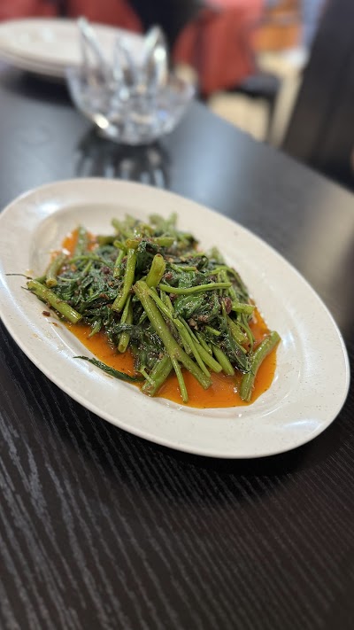Stir-fried long beans with garlic and chili on orange sauce, served at 1036 Fusion restaurant — Items: Stir-fried Long Beans