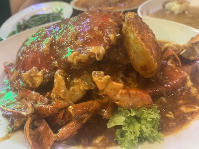 Chili Crab - whole crab coated in spicy chili sauce with lettuce garnish at 1036 Fusion restaurant — Items: Chili Crab
