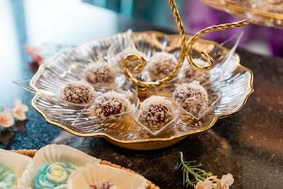 Kueharmony Nonya Kueh pre-order featuring chocolate truffles coated in cocoa powder served in an ornate gold-rimmed shell dish with decorative elements. — Items: Chocolate Truffles / Cocoa Balls · Nonya Kueh / Traditional Dessert