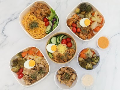 N2 No Nonsense Foods meal prep bowls featuring spicy ramen, beef and chicken rice bowls with eggs, roasted vegetables, broccoli, and accompanied by peanut and creamy dressings. — Items: Spicy Chicken Ramen · Beef Rice Bowl with Egg · Chicken Rice Bowl with Egg and Vegetables · Mixed Protein Rice Bowl with Egg · Roasted Vegetables Side · Grilled Tofu with Herbs · Peanut Sauce · Creamy Dressing