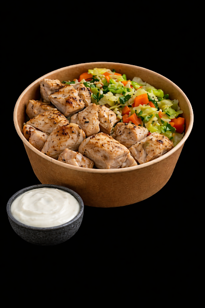 Grilled chicken pieces served in a kraft bowl with colorful vegetable fried rice and a side of creamy sour cream sauce. — Items: Grilled Chicken Bowl with Vegetable Fried Rice · Sour Cream or Yogurt Sauce