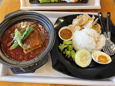 Claypot fish head curry with fried wonton crisps, white rice, cucumber, boiled egg and chili sauce from Loka Loka Ang Mo Kio restaurant. — Items: Claypot Fish Head Curry · Fried Wonton Crisps · White Rice · Cucumber Slices · Half Boiled Egg · Chili Dipping Sauce