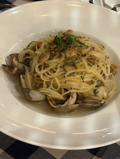 Spaghetti with Clams pasta dish from d.o.c Italian Restaurant, featuring linguine noodles with littleneck clams, garlic, and fresh parsley in white wine sauce. — Items: Spaghetti with Clams