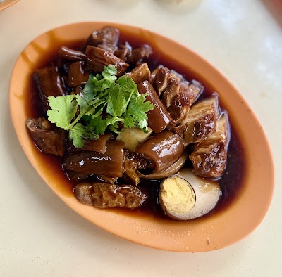 Braised duck with kway chap served in rich dark gravy, garnished with fresh cilantro and hard-boiled egg from AC Braised Duck and Kway Chap. — Items: Braised Duck with Kway Chap