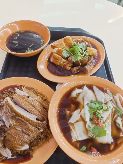AC Braised Duck and Kway Chap Food Enterprise serves braised duck rice, duck noodle soup, kway chap, and fish cake noodle soup with dark gravy sauce, garnished with cilantro. — Items: Braised Duck with Rice · Duck Noodle Soup · Kway Chap (Flat Rice Noodles in Gravy) · Fish Cake Noodle Soup · Dark Sauce Soup