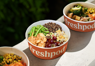 Freshpod healthy meal bowls featuring quinoa, grilled protein, green beans, red grapes, corn, broccoli and roasted vegetables served in branded orange bowls. — Items: Quinoa Bowl with Vegetables and Protein · Mixed Vegetable Bowl · Green Beans · Red Grapes · Tofu or Paneer Protein · Corn · Broccoli