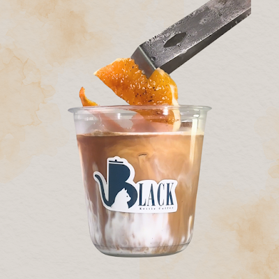 Black Kettle Coffee iced coffee drink with fresh orange peel garnish and knife detail shot — Items: Iced Coffee with Orange Peel Garnish